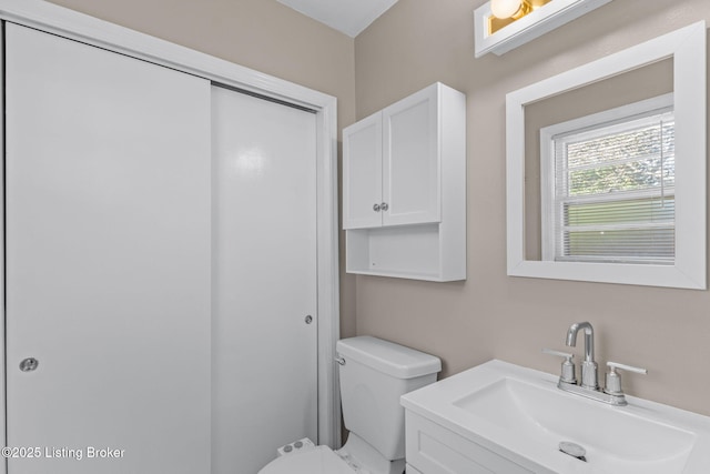 bathroom featuring toilet and a sink