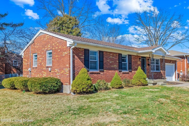 view of front of house with a garage, brick siding, and a front yard