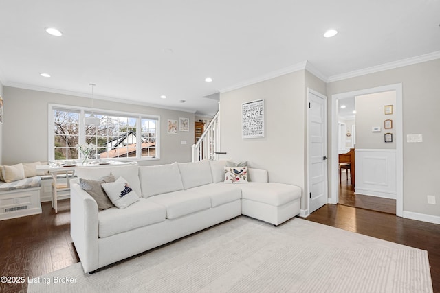 living area featuring recessed lighting, wood finished floors, and crown molding