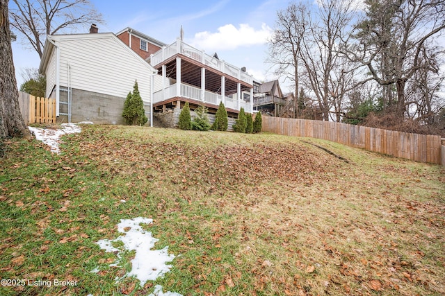 back of property featuring a chimney and fence