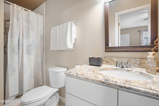 full bathroom with a shower with shower curtain, vanity, and toilet