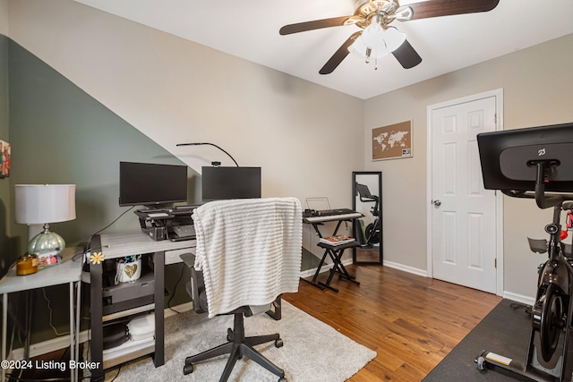 office area featuring a ceiling fan, baseboards, and wood finished floors