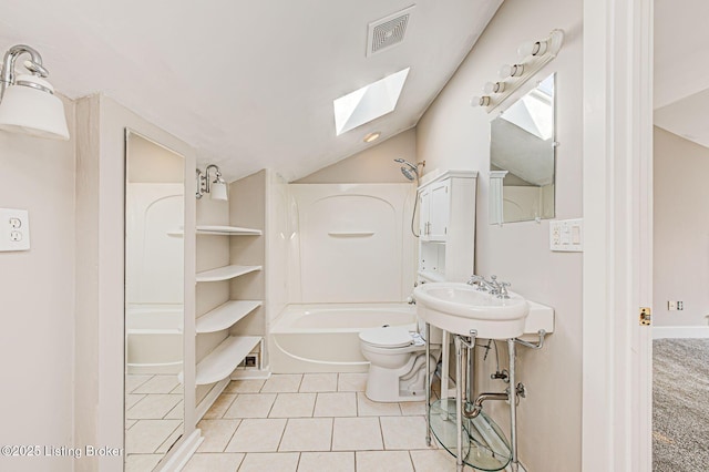 bathroom featuring shower / bathtub combination, visible vents, toilet, tile patterned flooring, and vaulted ceiling with skylight