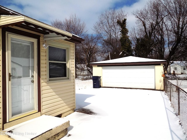 exterior space with a garage and fence