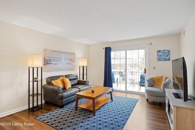 living room featuring visible vents, baseboards, and dark wood finished floors