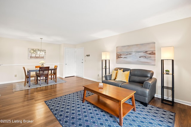 living room featuring baseboards and wood finished floors