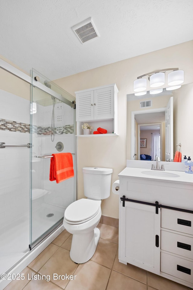 full bath with tile patterned flooring, visible vents, vanity, and toilet