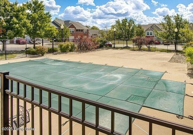 view of pool with a patio area, fence, and a fenced in pool