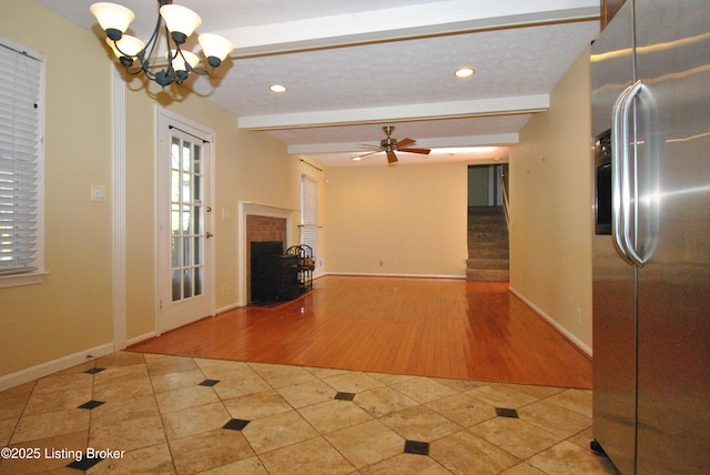 tiled foyer entrance featuring baseboards, a tiled fireplace, ceiling fan with notable chandelier, beam ceiling, and recessed lighting