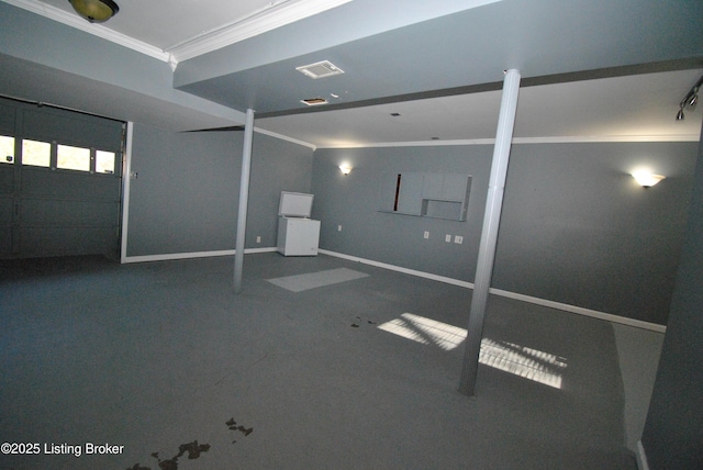 interior space featuring baseboards, visible vents, and crown molding