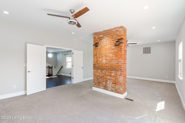 carpeted spare room featuring ceiling fan, baseboards, visible vents, and recessed lighting