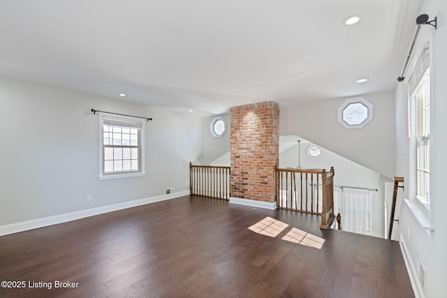 interior space featuring recessed lighting, wood finished floors, visible vents, and baseboards