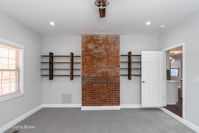 carpeted empty room with recessed lighting, visible vents, and baseboards