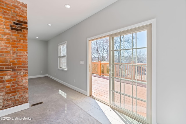 doorway to outside with baseboards, visible vents, a wealth of natural light, and recessed lighting