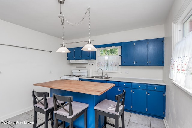 kitchen featuring blue cabinets, light tile patterned flooring, a sink, and white range with gas cooktop