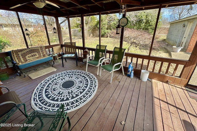 sunroom / solarium with ceiling fan