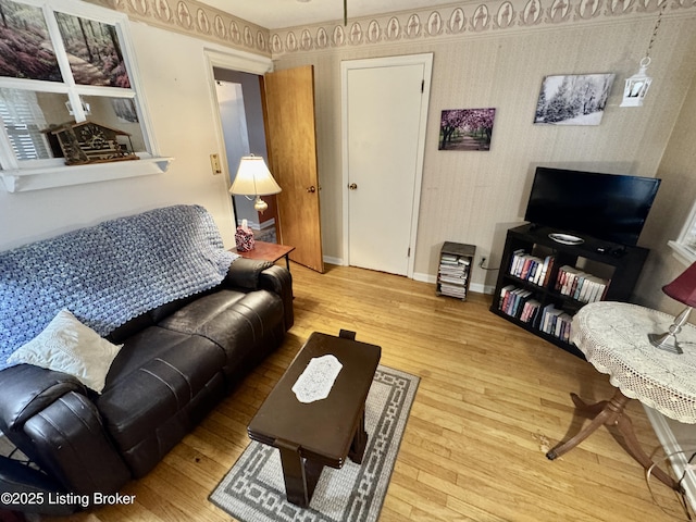 living room with wood finished floors and baseboards