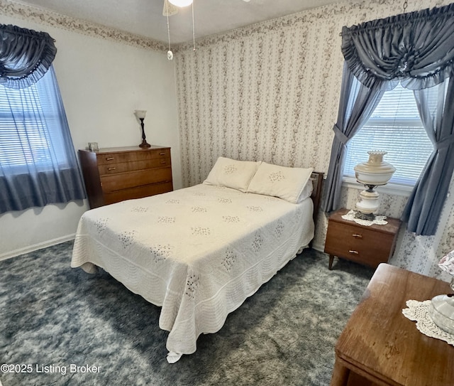 bedroom featuring carpet and baseboards