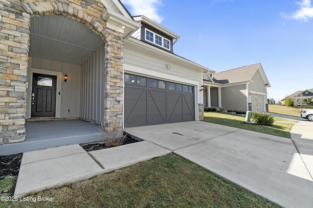 view of property exterior with stone siding and driveway