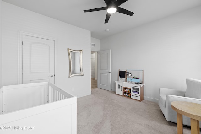 bedroom with carpet, visible vents, ceiling fan, and baseboards