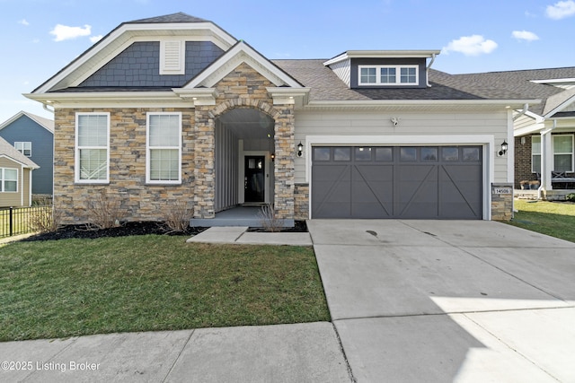 craftsman-style home featuring a garage, a shingled roof, concrete driveway, fence, and a front lawn