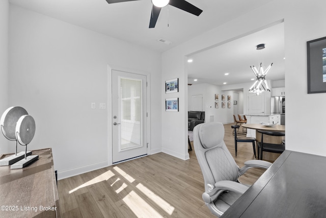 home office featuring light wood-style floors, baseboards, visible vents, and recessed lighting