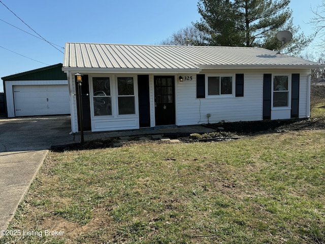 ranch-style home featuring metal roof, covered porch, and a front yard