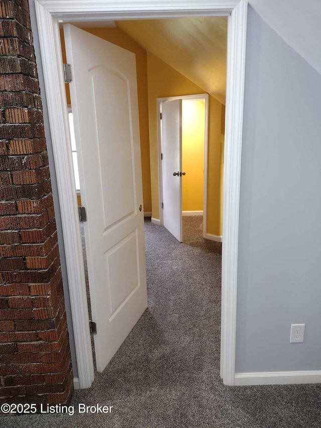 corridor featuring carpet and baseboards