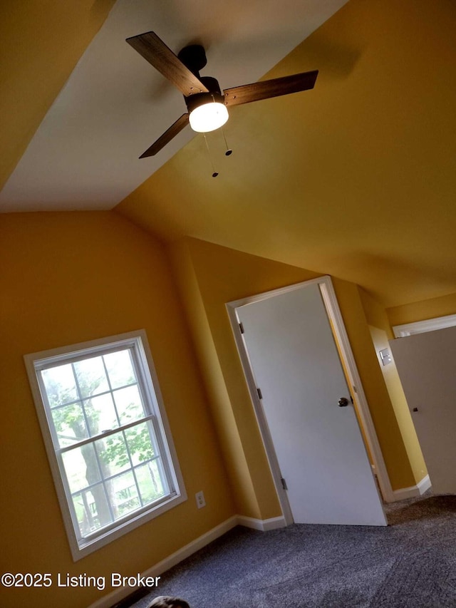 additional living space featuring lofted ceiling, ceiling fan, carpet, and baseboards