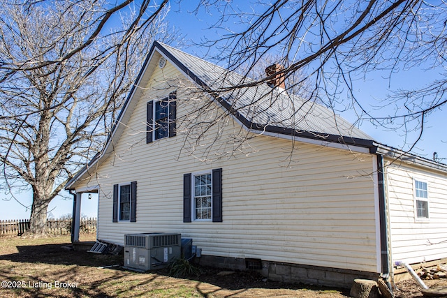 view of home's exterior with cooling unit and crawl space