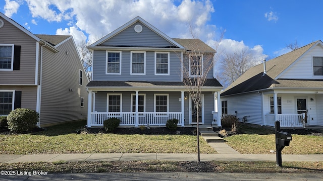 traditional home with a porch and a front yard