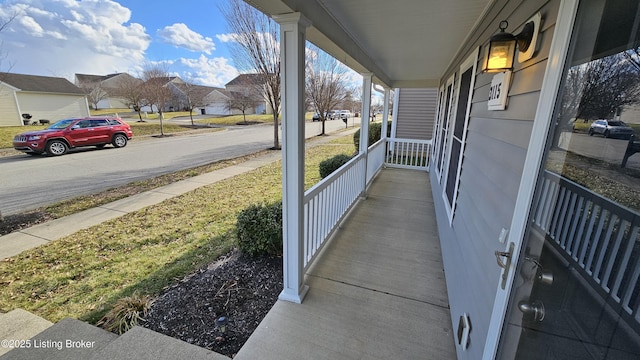 exterior space with a residential view and a porch