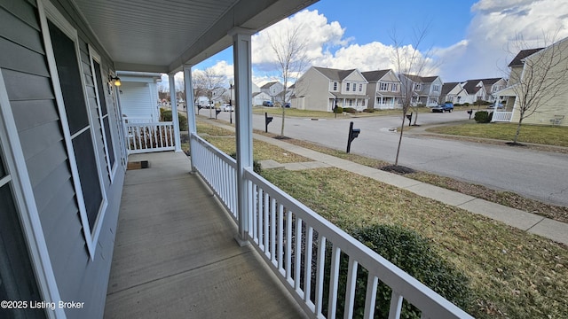 balcony featuring a porch and a residential view