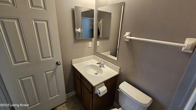 bathroom with toilet and vanity