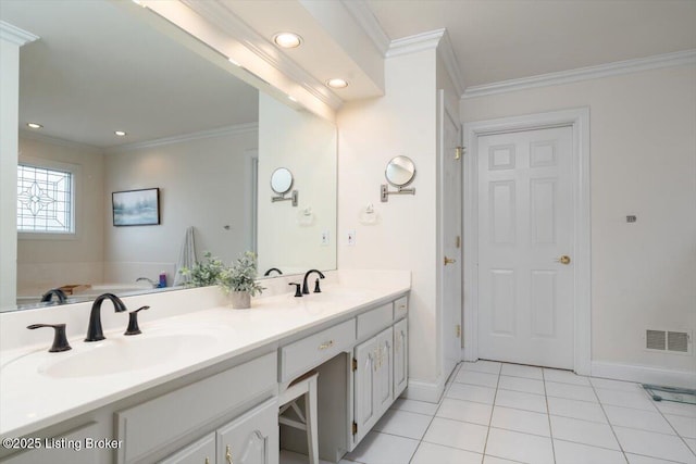 bathroom with tile patterned floors, a sink, visible vents, and crown molding