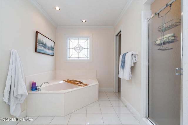 bathroom featuring tile patterned flooring, a garden tub, crown molding, and a shower stall