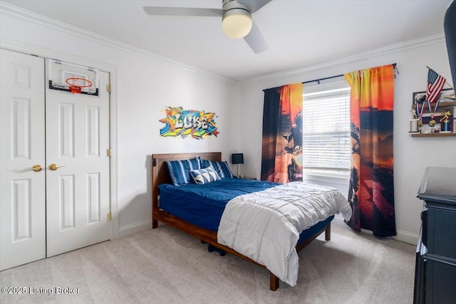 bedroom featuring ceiling fan, ornamental molding, carpet flooring, and baseboards