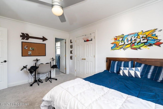 carpeted bedroom featuring a closet, crown molding, baseboards, and ceiling fan