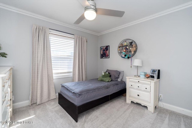 bedroom with light carpet, a ceiling fan, baseboards, and crown molding