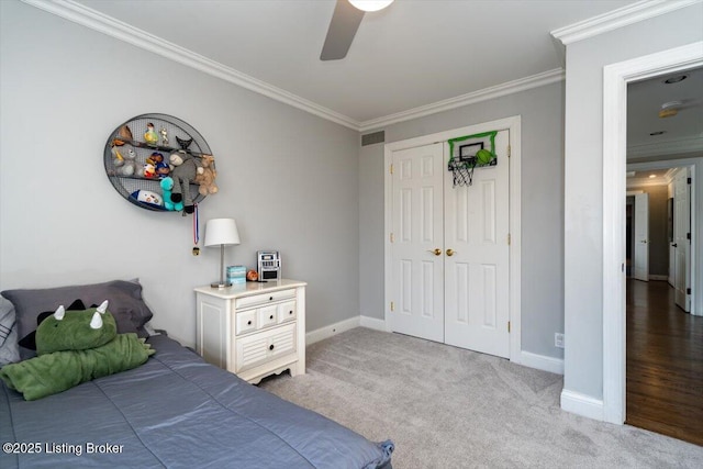 carpeted bedroom with ornamental molding, visible vents, and baseboards