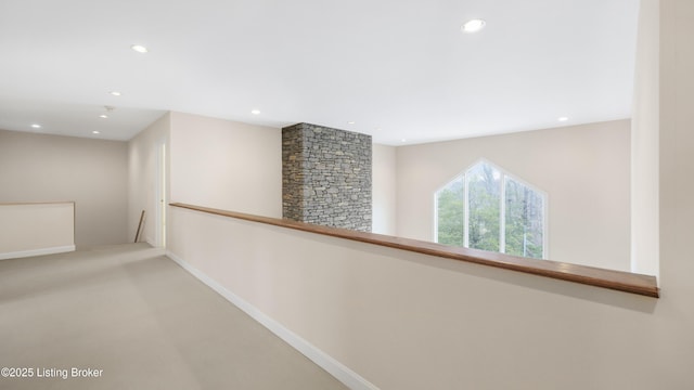 corridor with recessed lighting, baseboards, and an upstairs landing