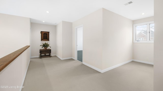 hall with light carpet, recessed lighting, and baseboards