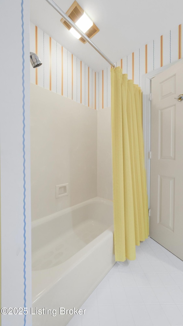 full bath featuring shower / bath combo with shower curtain and visible vents