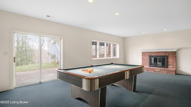 game room with a fireplace, carpet flooring, and a healthy amount of sunlight