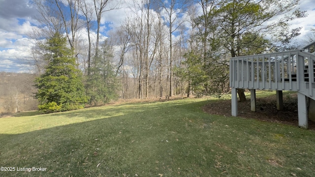 view of yard featuring a wooden deck