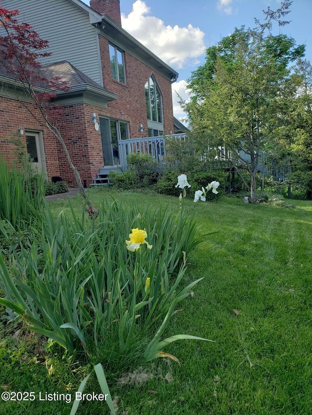 view of yard featuring a wooden deck