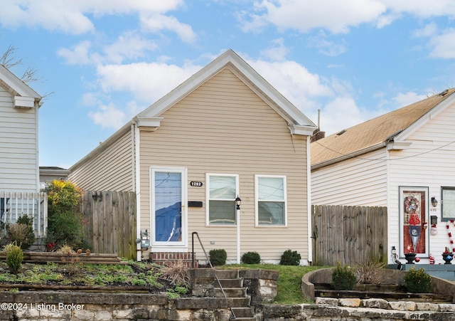 view of front facade featuring fence