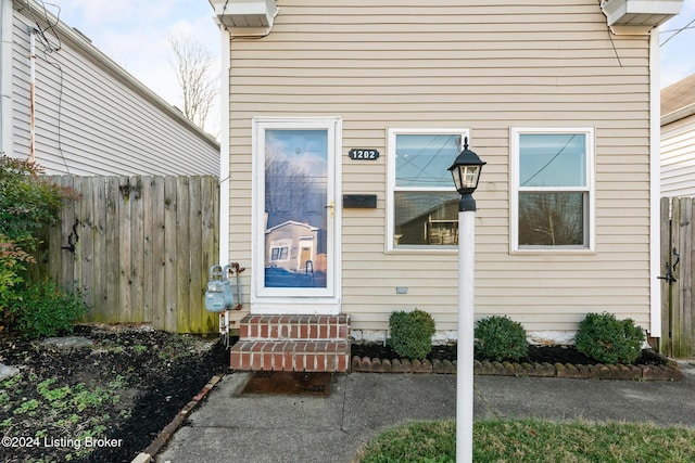 property entrance featuring fence