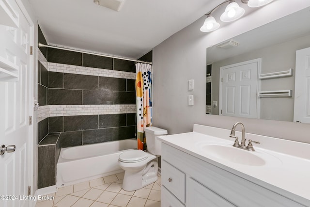 bathroom with visible vents, toilet, shower / bath combo with shower curtain, vanity, and tile patterned flooring