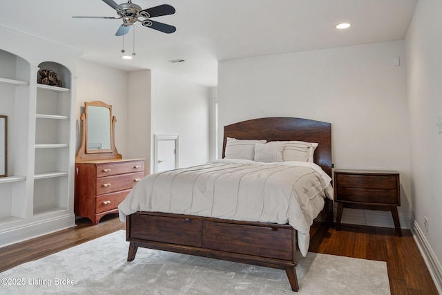 bedroom featuring baseboards, visible vents, wood finished floors, and recessed lighting